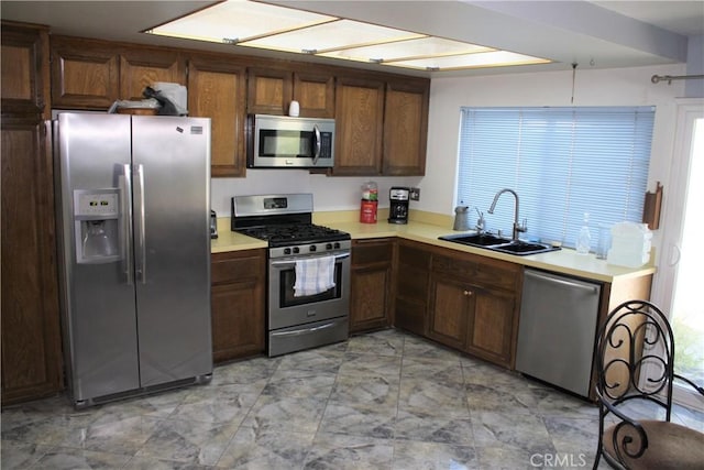 6320 Amberwood Dr, Rancho Cucamonga, CA 91701 - kitchen featuring light countertops, marble finish floor, a sink, and stainless steel appliances