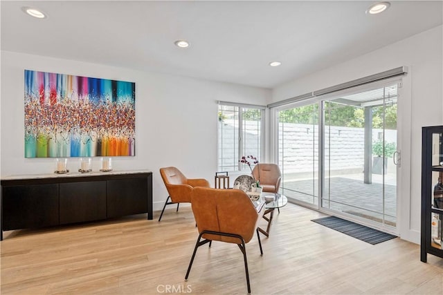 sitting room with recessed lighting, light wood-style flooring, and baseboards
