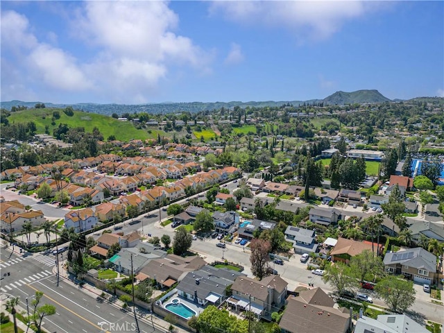 birds eye view of property with a residential view and a mountain view