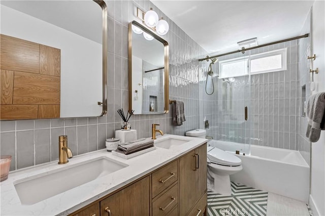 full bathroom with  shower combination, tile walls, a sink, and toilet