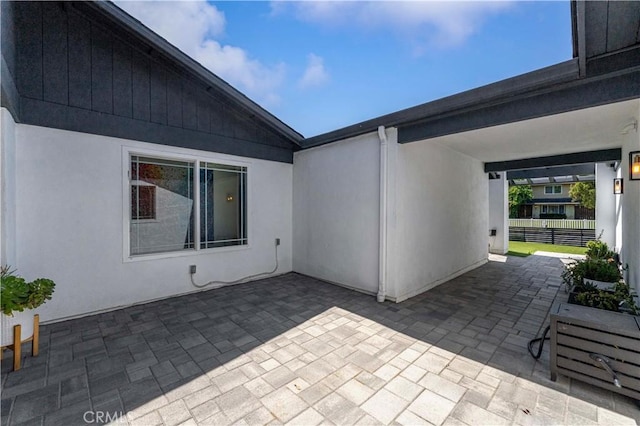 view of patio featuring fence
