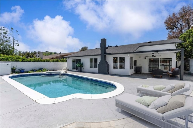 view of swimming pool with a patio, outdoor lounge area, and a fenced backyard
