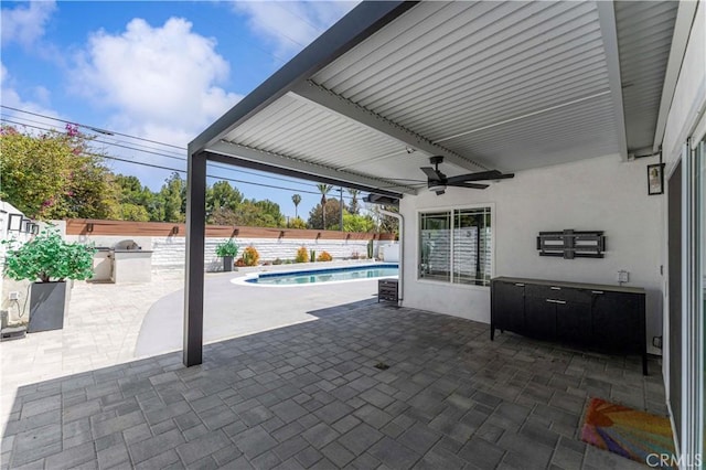 view of patio / terrace featuring a fenced in pool, a fenced backyard, and ceiling fan