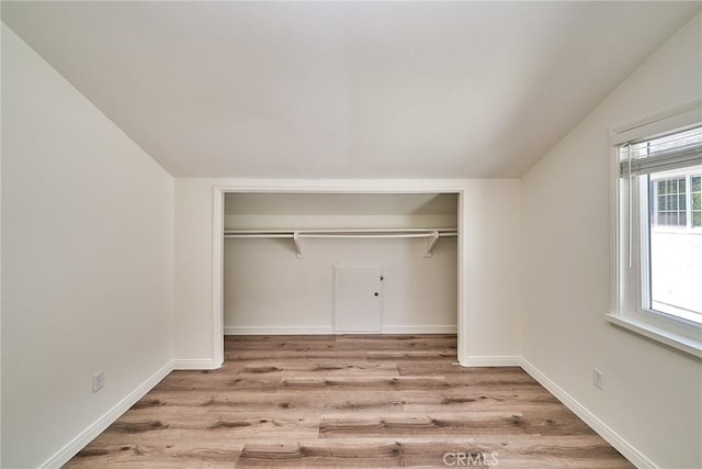19910 Cantara St, Winnetka, CA 91306 - unfurnished bedroom featuring wood finished floors, baseboards, and lofted ceiling