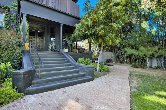 doorway to property with a porch