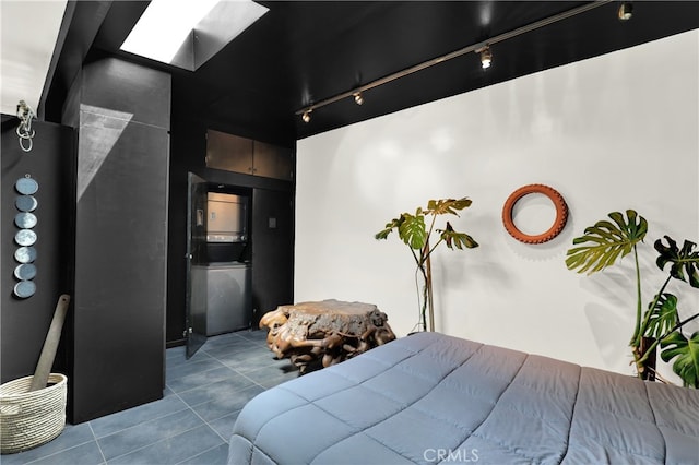 801 E Edgeware Rd, Los Angeles, CA 90026 - bedroom featuring tile patterned floors, rail lighting, and a skylight