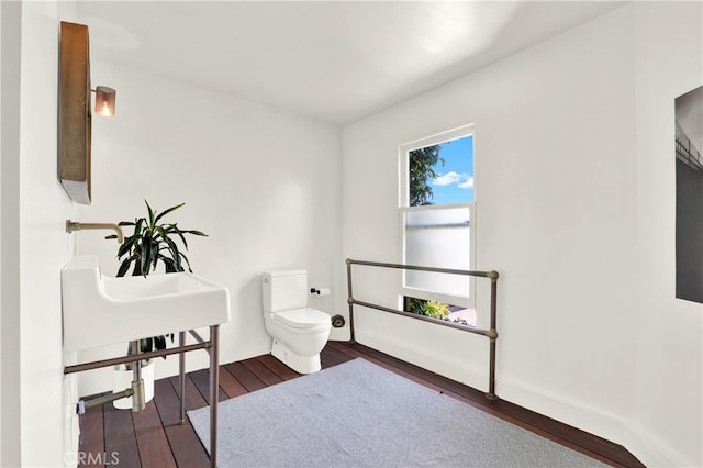 801 E Edgeware Rd, Los Angeles, CA 90026 - bathroom with hardwood / wood-style floors, toilet, and baseboards
