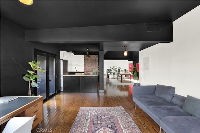 living area featuring dark wood-style floors