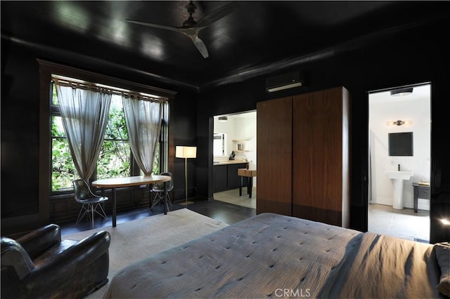 801 E Edgeware Rd, Los Angeles, CA 90026 - bedroom featuring a wall mounted air conditioner, connected bathroom, and a sink