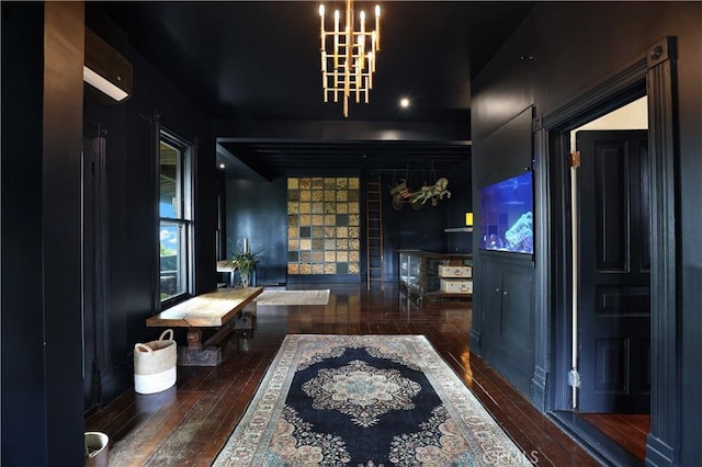 interior space featuring wood-type flooring and an inviting chandelier