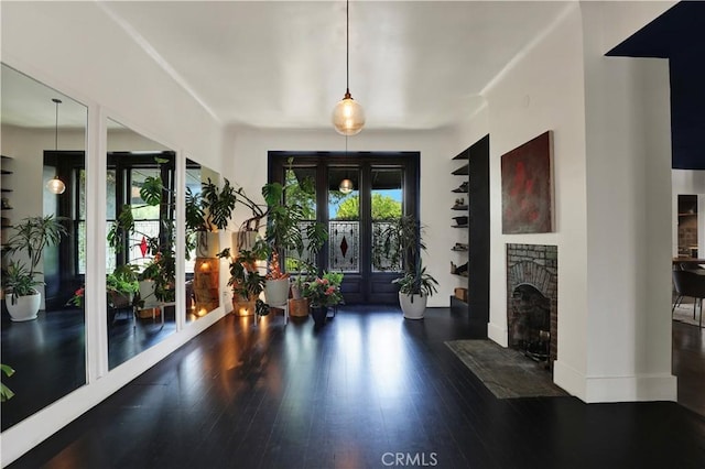 801 E Edgeware Rd, Los Angeles, CA 90026 - foyer with wood finished floors and a brick fireplace