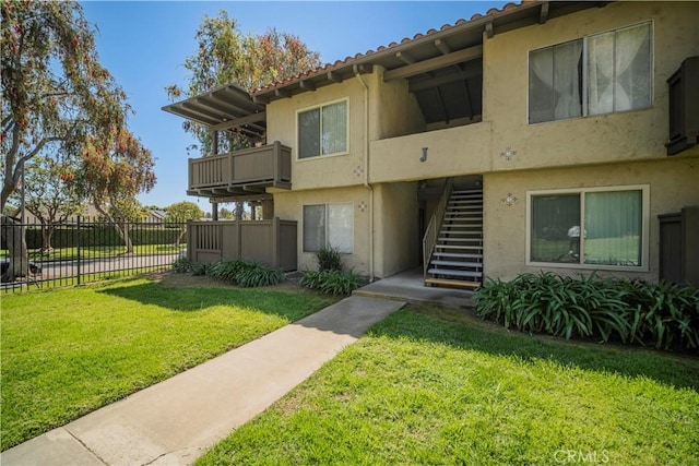 1345 Cabrillo Park Dr Unit J02, Santa Ana, CA 92701 - view of property featuring stairs and fence