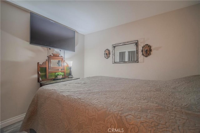 1345 Cabrillo Park Dr Unit J02, Santa Ana, CA 92701 - bedroom with baseboards and wood finished floors