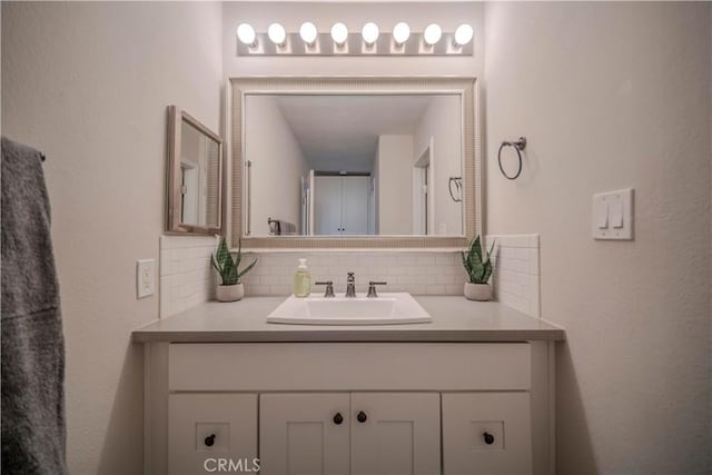 1345 Cabrillo Park Dr Unit J02, Santa Ana, CA 92701 - bathroom with tasteful backsplash and vanity