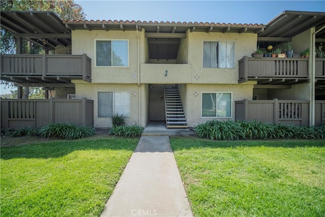 1345 Cabrillo Park Dr Unit J02, Santa Ana, CA 92701 - view of property featuring stairway and fence