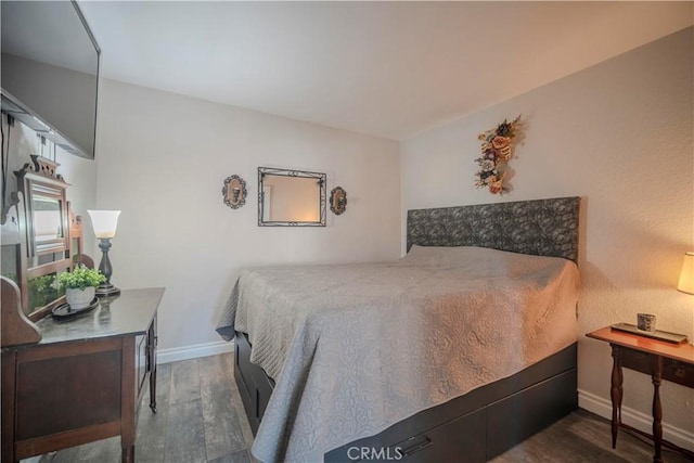 1345 Cabrillo Park Dr Unit J02, Santa Ana, CA 92701 - bedroom with wood finished floors, baseboards, and a desk