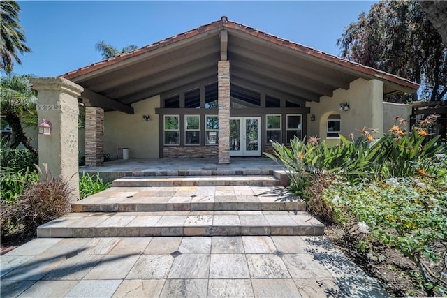 1345 Cabrillo Park Dr Unit J02, Santa Ana, CA 92701 - back of house featuring stucco siding and french doors