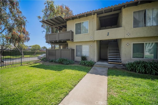 1345 Cabrillo Park Dr Unit J02, Santa Ana, CA 92701 - view of building exterior featuring stairway and fence
