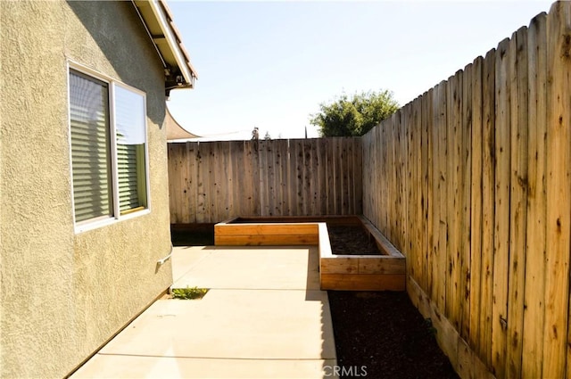 view of yard with a patio area and a fenced backyard