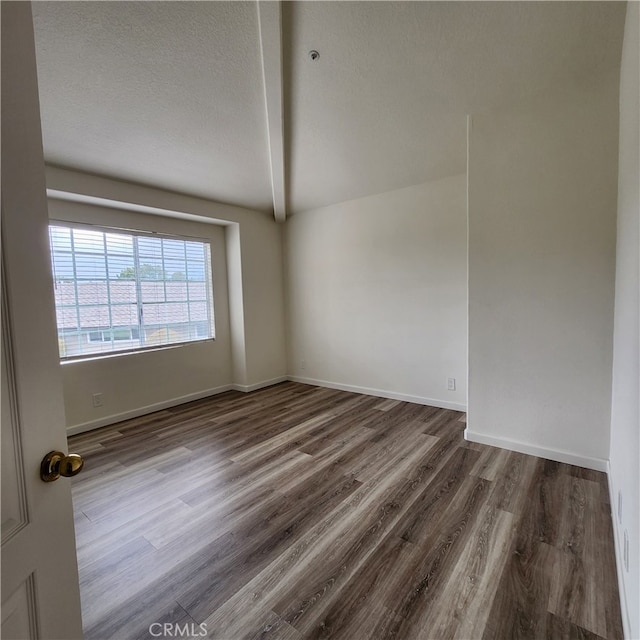907 W Arrow, Claremont, CA 91711 - spare room featuring lofted ceiling, wood finished floors, a textured ceiling, and baseboards
