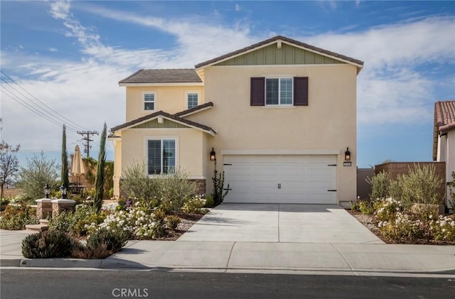 traditional-style home with stucco siding, concrete driveway, and a garage