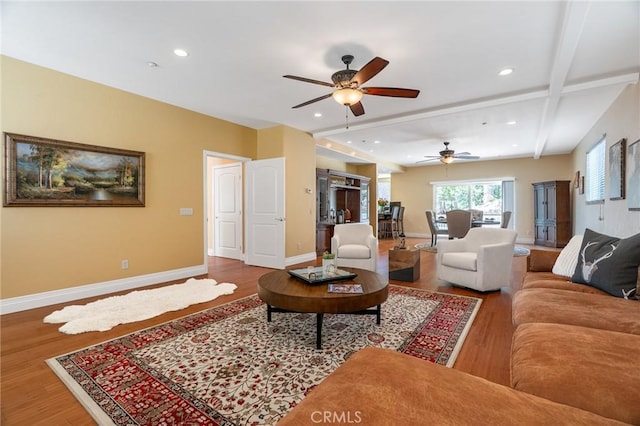 living room with baseboards, recessed lighting, ceiling fan, and wood finished floors