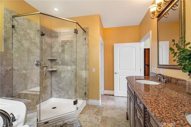 27732 N Bay Rd, Lake Arrowhead, CA 92352 - bathroom featuring a stall shower, vanity, a garden tub, and baseboards