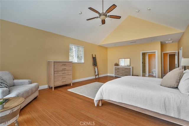 bedroom with baseboards, high vaulted ceiling, a ceiling fan, and wood finished floors