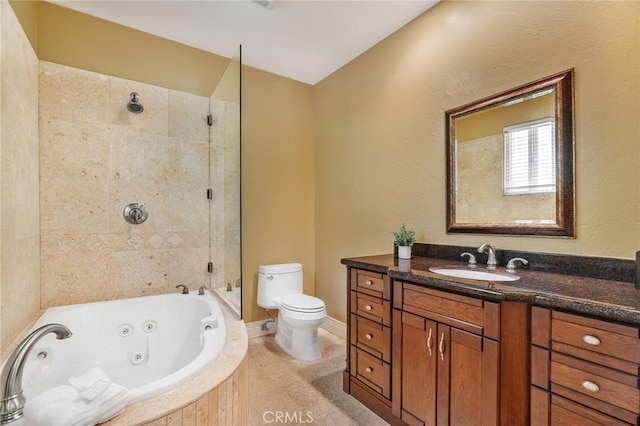 bathroom featuring toilet, a tub with jets, tiled shower, and vanity
