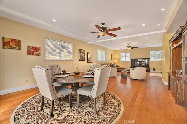 dining space with light wood-style floors, baseboards, a ceiling fan, and recessed lighting