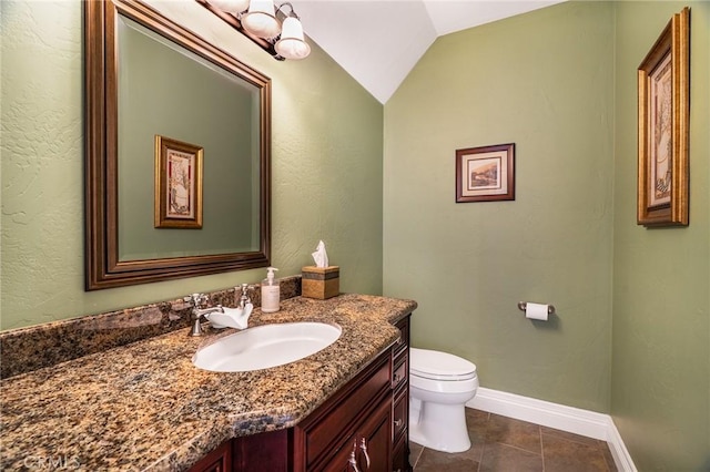 27732 N Bay Rd, Lake Arrowhead, CA 92352 - half bath with toilet, vanity, lofted ceiling, tile patterned flooring, and baseboards