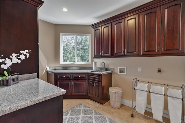 washroom featuring a sink, cabinet space, hookup for an electric dryer, recessed lighting, and washer hookup