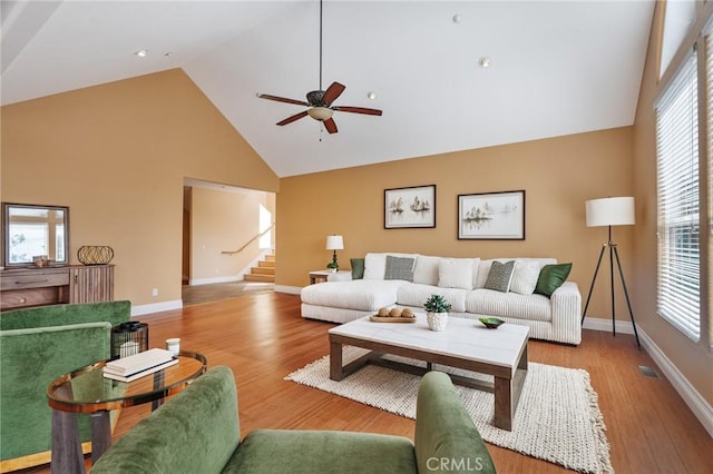 27732 N Bay Rd, Lake Arrowhead, CA 92352 - living room featuring high vaulted ceiling, baseboards, a ceiling fan, stairs, and wood finished floors
