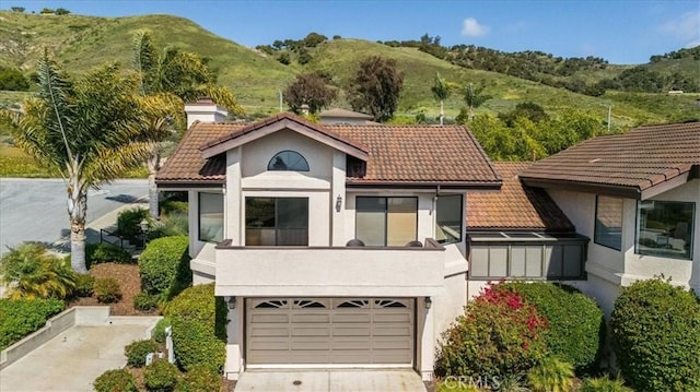 101 Searidge Ct, Pismo Beach, CA 93449 - view of front of property featuring a tile roof, driveway, and stucco siding