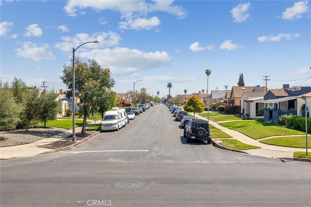 view of street with sidewalks and curbs