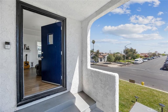 entrance to property with stucco siding
