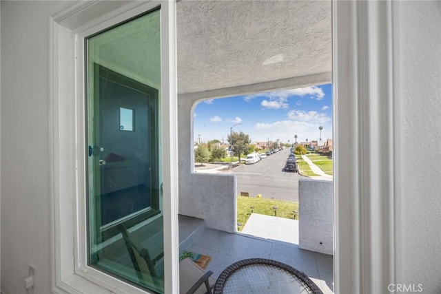 entryway with a textured ceiling