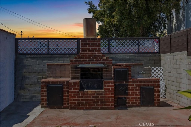 view of patio / terrace featuring fence