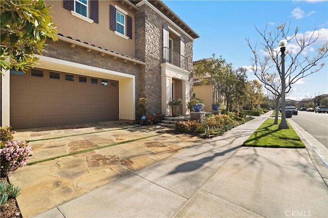 19 Dogwood, Lake Forest, CA 92630 - exterior space with an attached garage, stucco siding, stone siding, and a tile roof