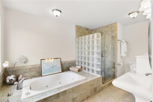 full bathroom featuring a shower stall, tile patterned floors, and a whirlpool tub