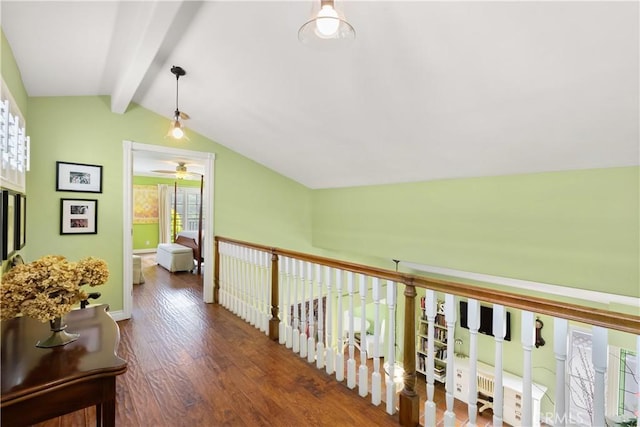 hallway featuring wood finished floors and lofted ceiling with beams