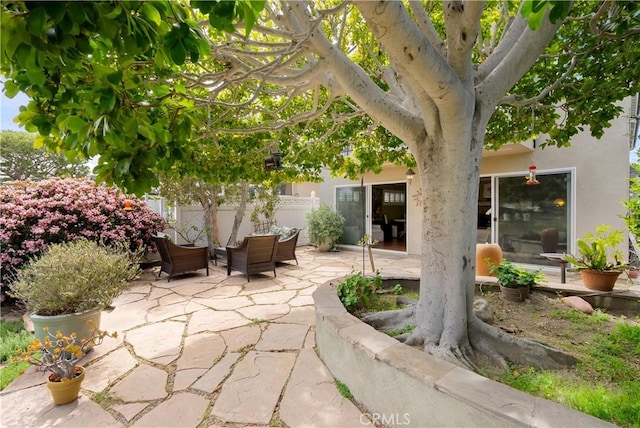 view of patio / terrace featuring fence