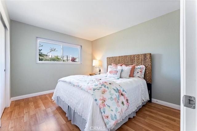 4811 Sharon Dr, La Palma, CA 90623 - bedroom with baseboards, light wood finished floors, and a closet