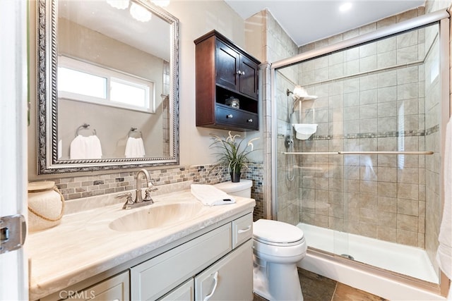 4811 Sharon Dr, La Palma, CA 90623 - bathroom featuring toilet, a shower stall, vanity, and decorative backsplash