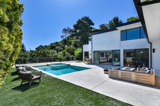 view of pool with a yard, a pool with connected hot tub, and a patio