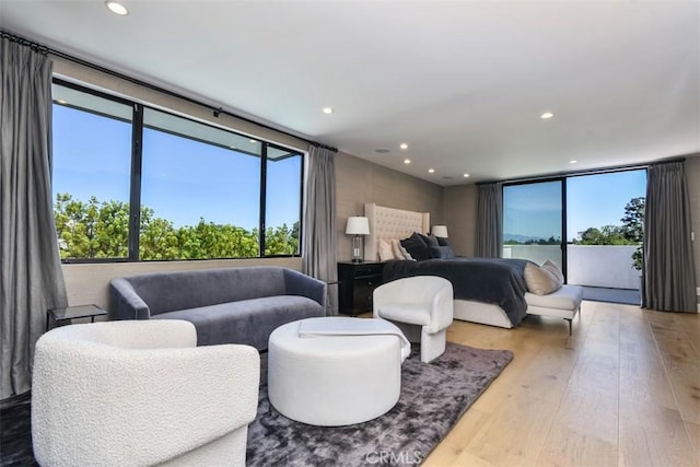 bedroom featuring recessed lighting and hardwood / wood-style floors