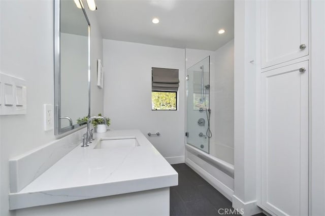 full bathroom featuring baseboards, recessed lighting, vanity, and tub / shower combination