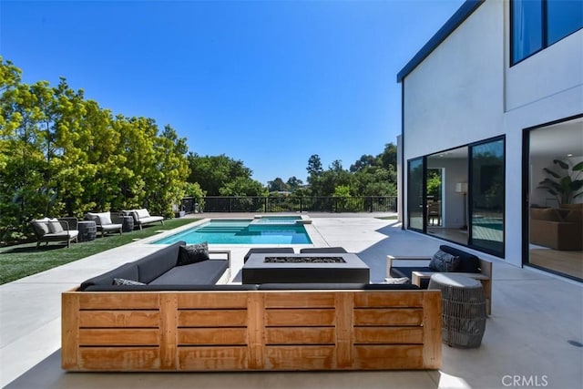 view of pool featuring an outdoor hangout area, a fenced in pool, and a patio area