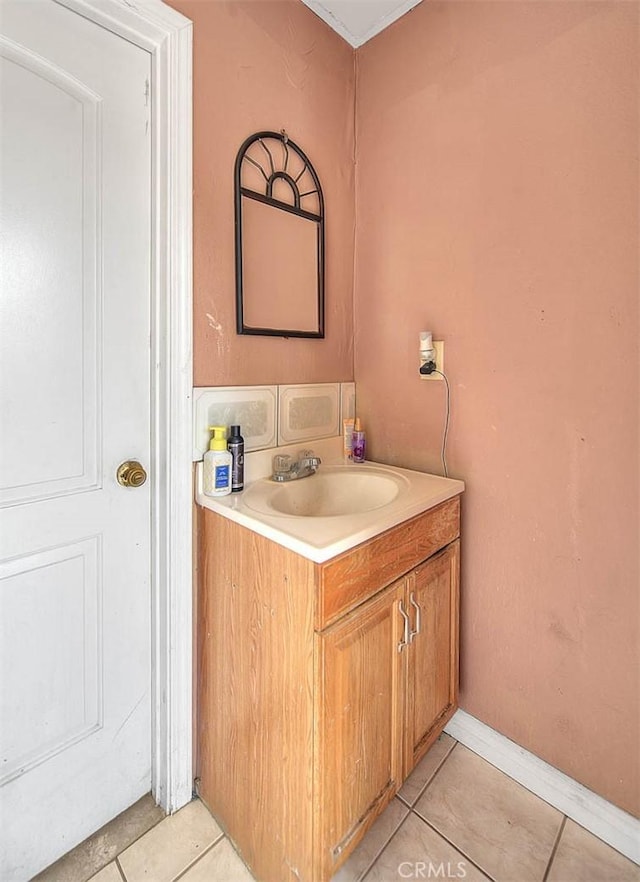 bathroom with tile patterned flooring and vanity