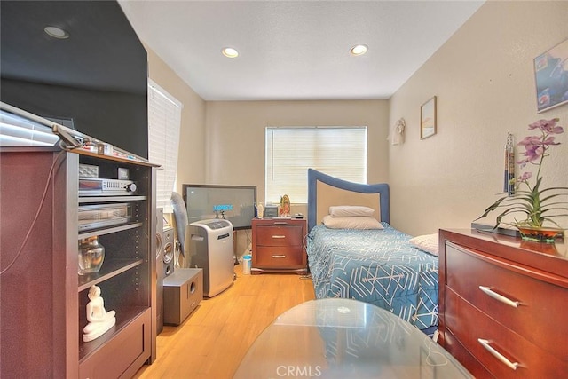 bedroom featuring light wood-style flooring and recessed lighting